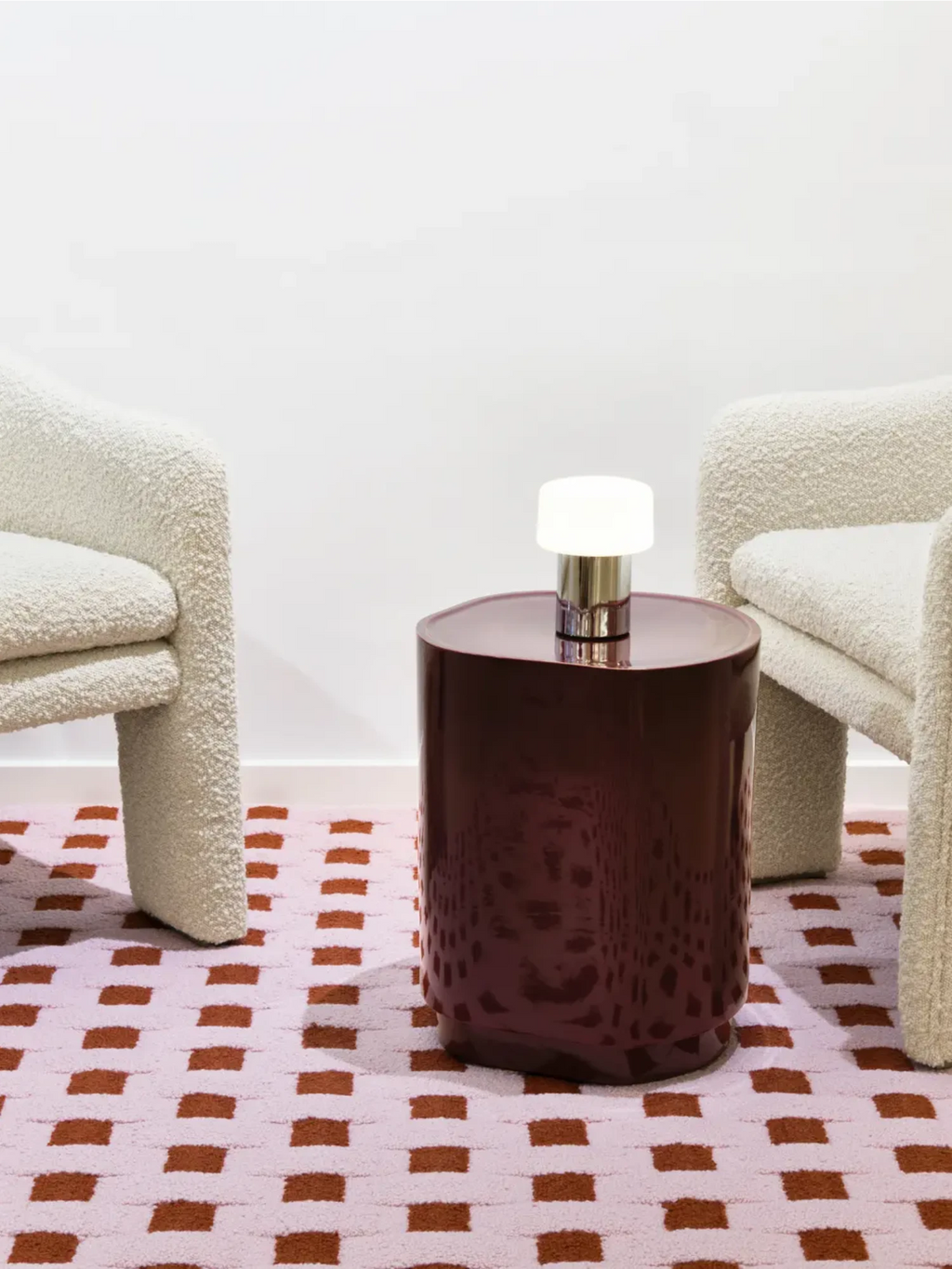 alp_ Cesta Rug, a contemporary hand-tufted wool area rug featuring a playful geometric pattern of burnt orange squares on a soft light pink background, creating a plush, textured pile. This modern patterned rug is ideal for adding a vibrant accent to a living room, bedroom, or nursery.