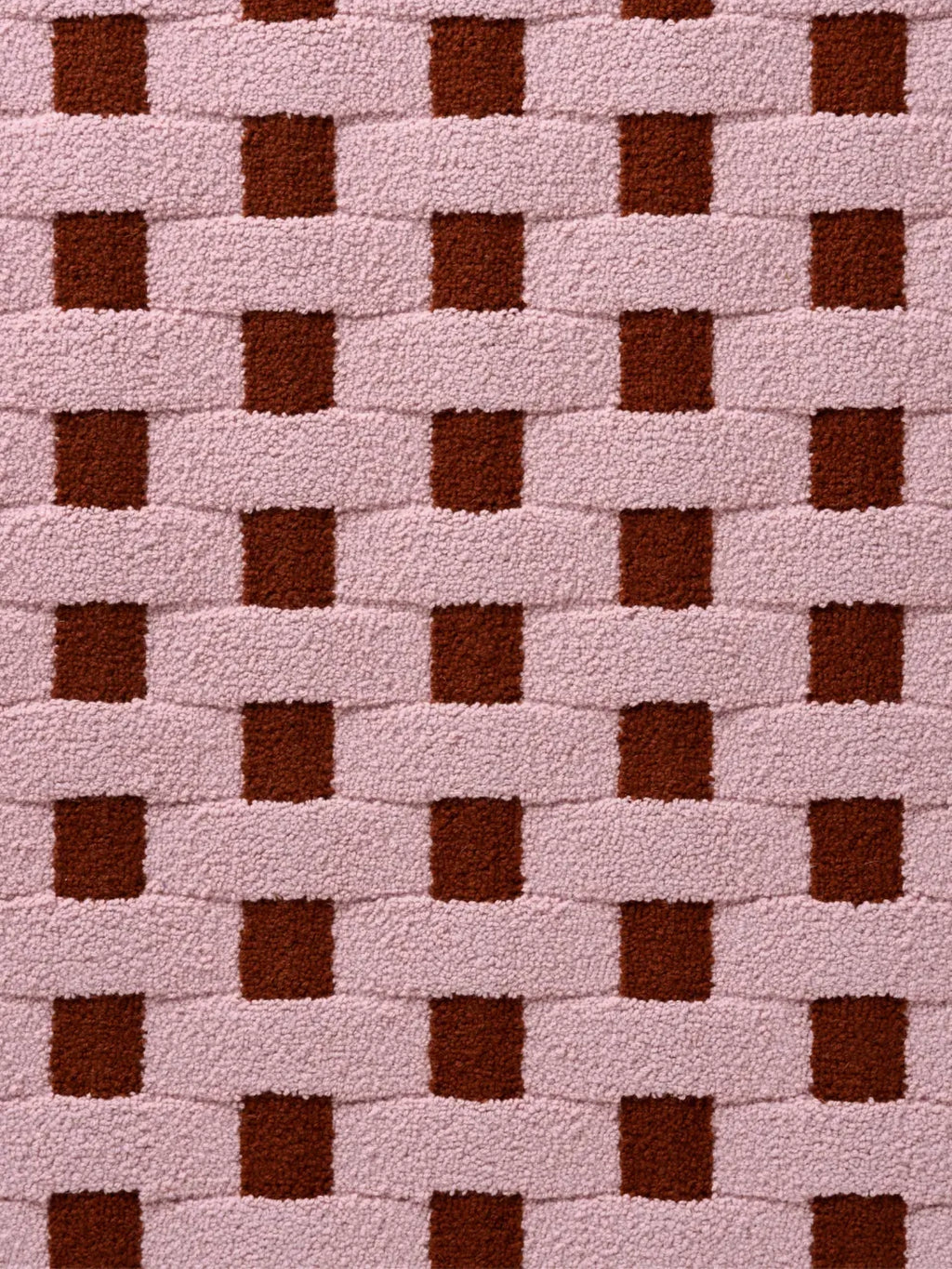 alp_ Cesta Rug, a contemporary hand-tufted wool rug featuring a bold geometric basket weave pattern in soft blush pink and rich terracotta brown hues.