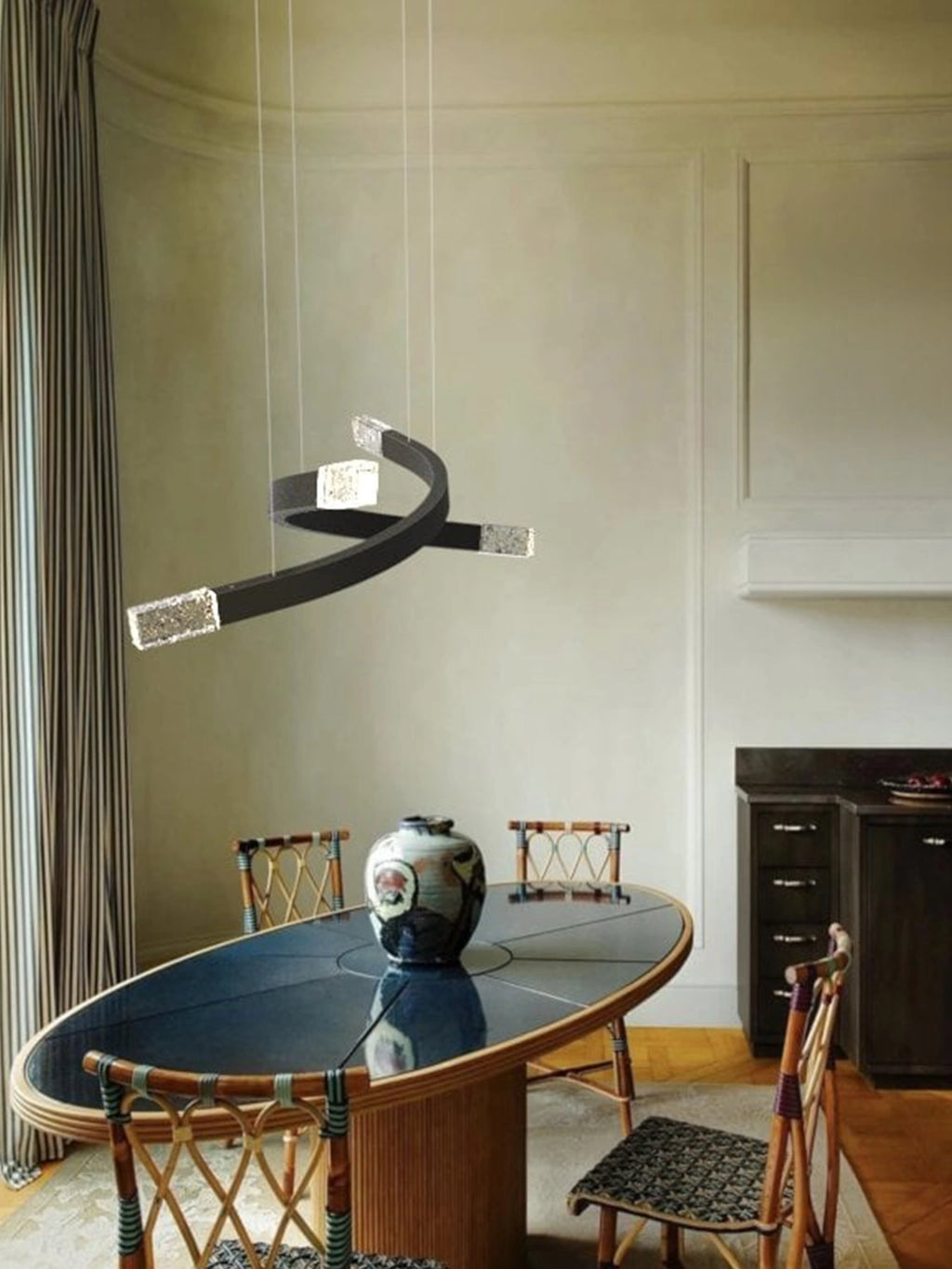 CTO Lighting Trace Linear X Chandelier, a striking modern sculptural pendant lamp featuring a dynamic curvilinear matte black metal frame intertwined with four rectangular textured crystal light elements, suspended by delicate wires. This luxury architectural lighting piece offers integrated LED illumination, perfect as a contemporary dining room chandelier or a statement lighting fixture for minimalist living spaces.