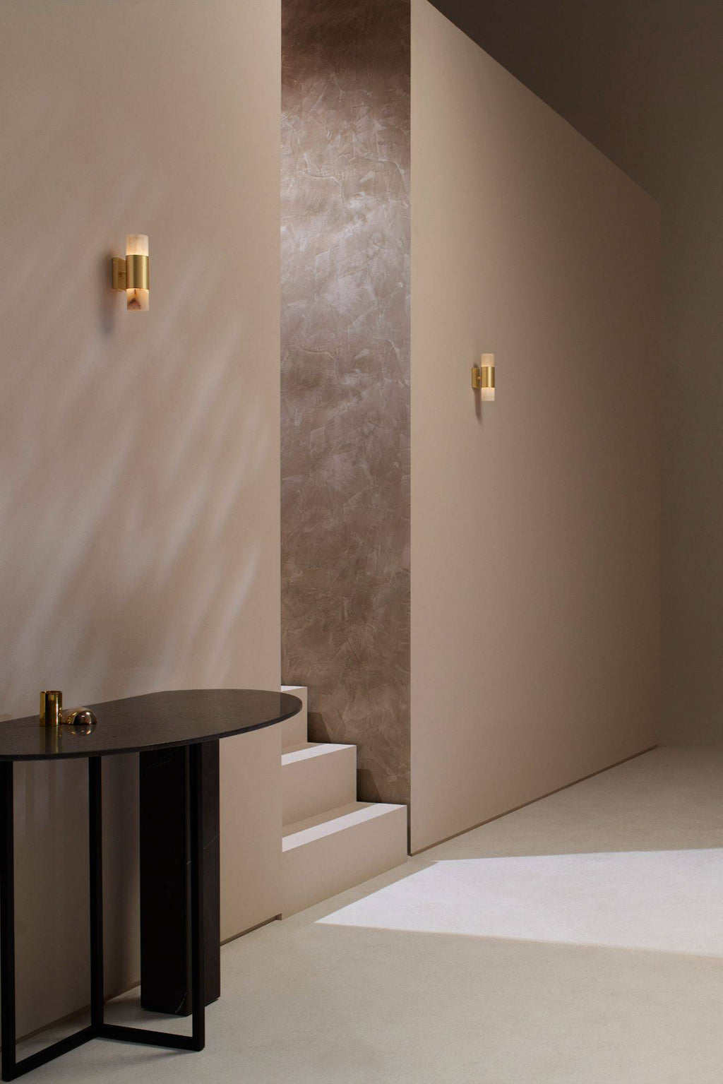 CTO Lighting Roma Wall Lamp, a luxurious modern minimalist wall sconce featuring a cylindrical brushed brass body with translucent natural alabaster light diffusers, providing elegant up-down ambient lighting. Ideal for sophisticated hallway lighting, contemporary living rooms, or high-end bedroom accents.