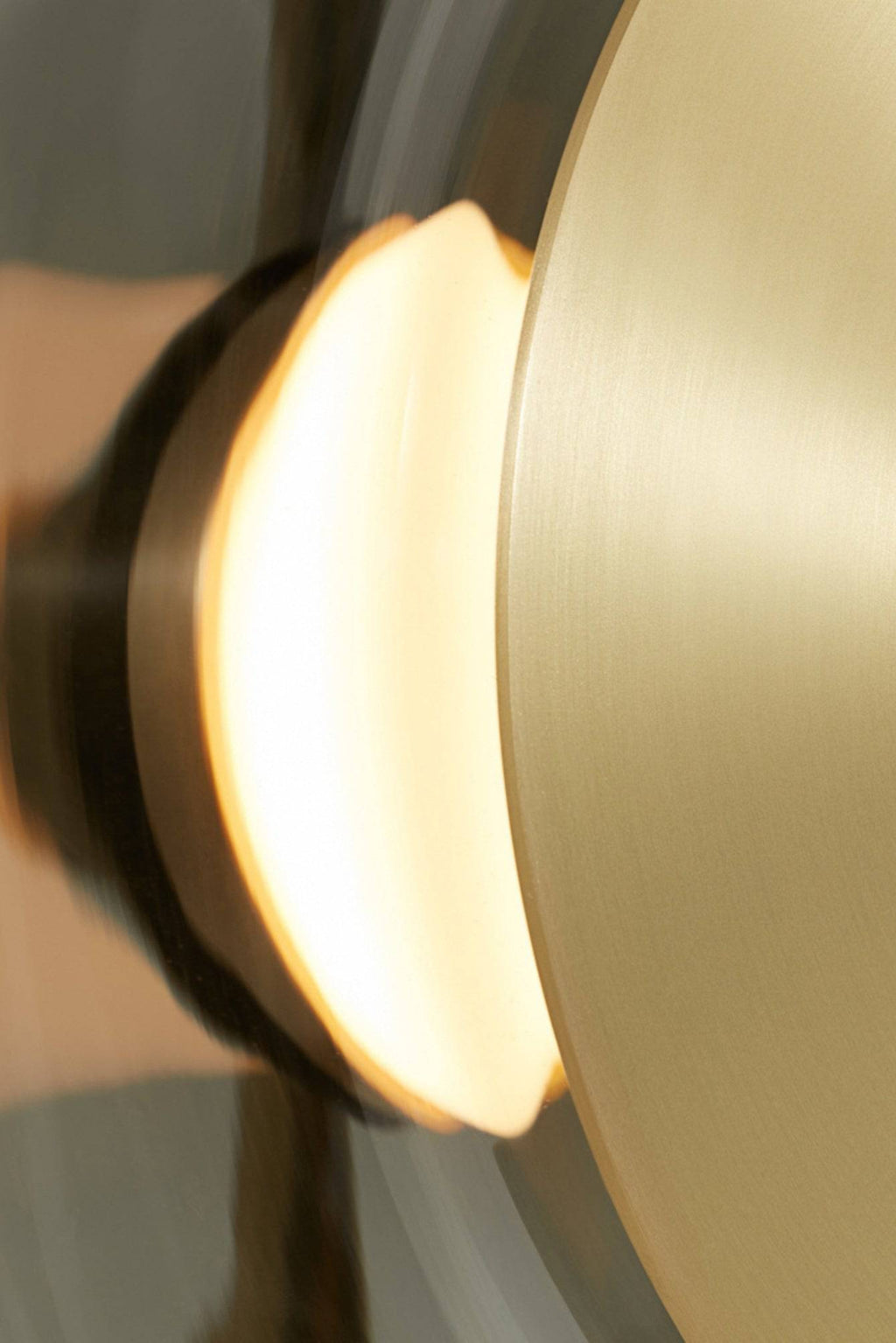 CTO Lighting Pendulum Floor Lamp, a striking modern minimalist floor lamp featuring a large circular brushed brass disc reflector and a warm, diffused light source. This contemporary luxury brass floor lamp provides ambient illumination with its sleek design. Perfect for illuminating a modern living room, sophisticated bedroom, or upscale home office.