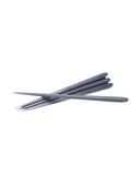 Unscented stoff nagel taper candles providing a soft, flickering glow for relaxation.