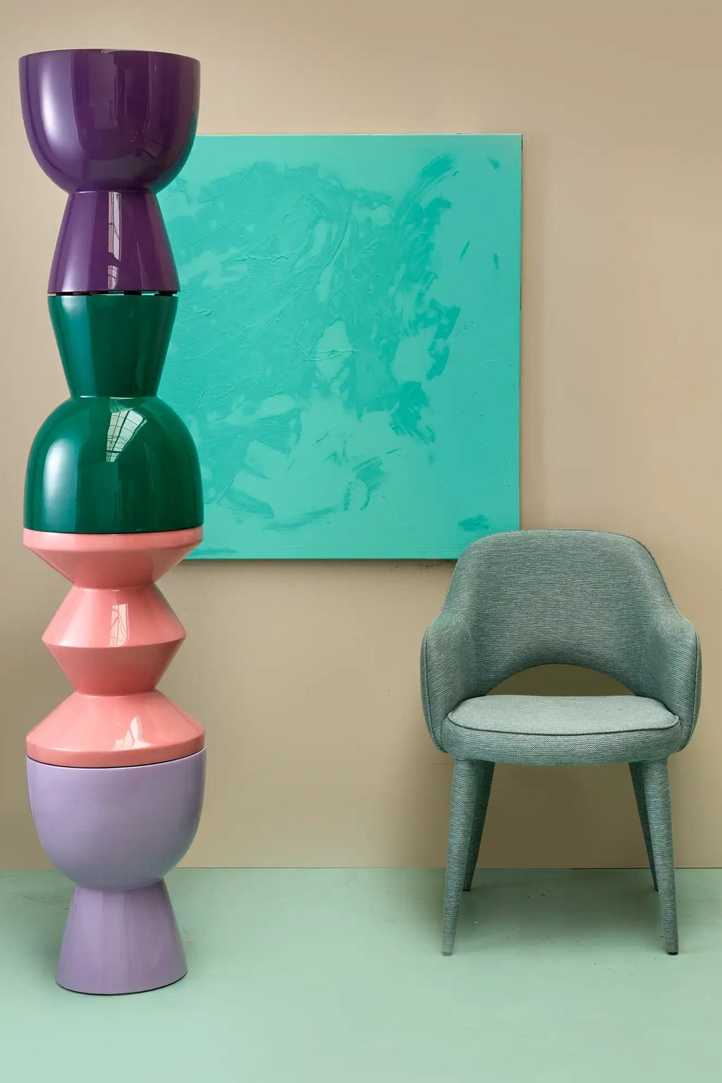 POLSPOTTEN Tip Tap Stool, a vibrant postmodern sculptural stool featuring stacked glossy lacquered ceramic segments in bold purple, dark green, pink, and lavender hues. This playful, artistic piece boasts a unique totem-like silhouette with a reflective finish, making it a striking accent. Ideal as a colorful side table or decorative stool for contemporary living rooms, entryways, or creative interior designs.