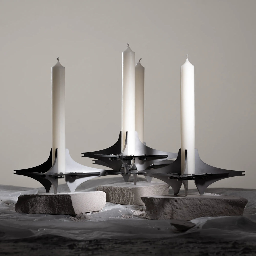  Sleek and versatile candle holder featuring interchangeable geometric components