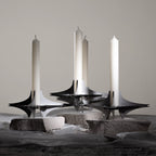  Sleek and versatile candle holder featuring interchangeable geometric components