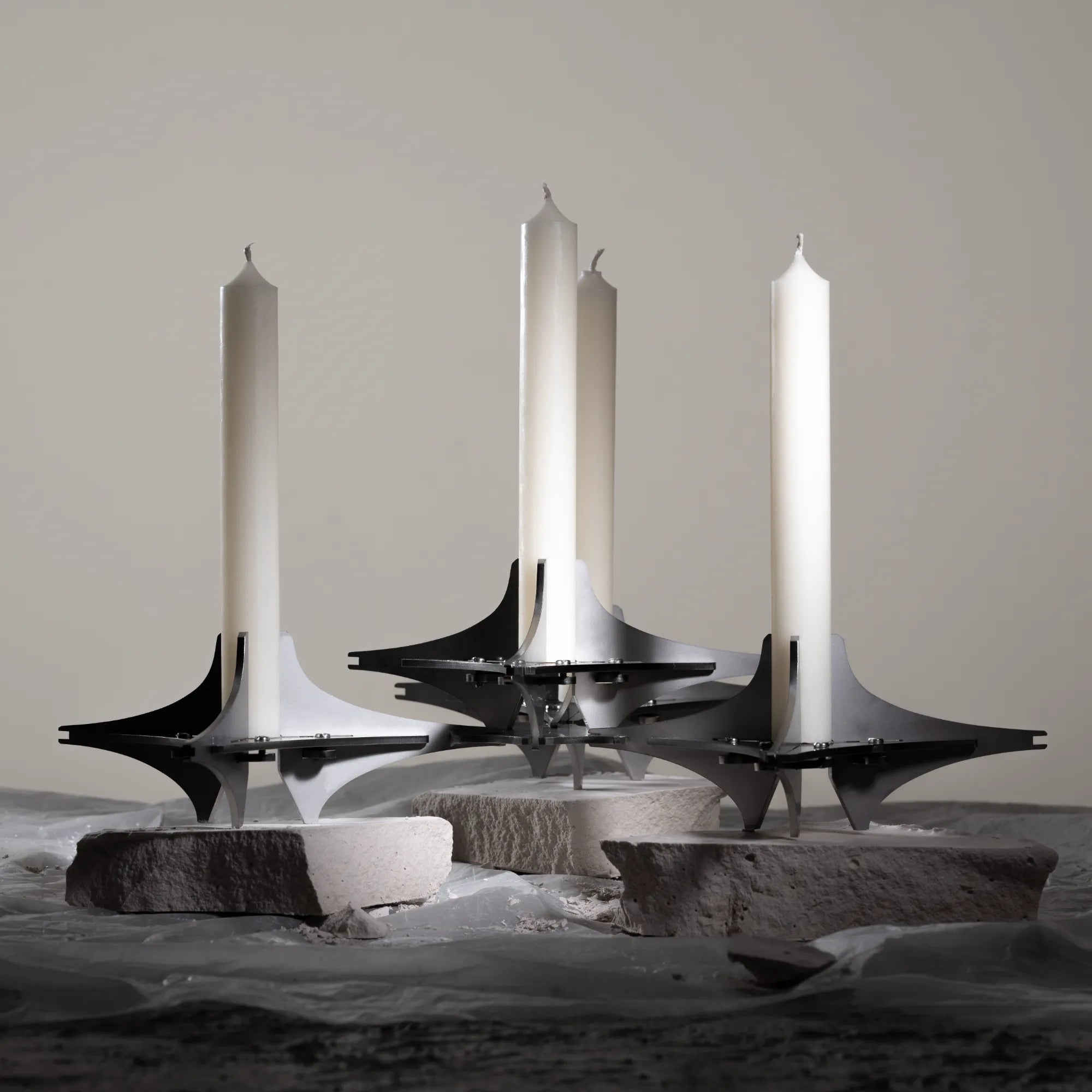  Sleek and versatile candle holder featuring interchangeable geometric components