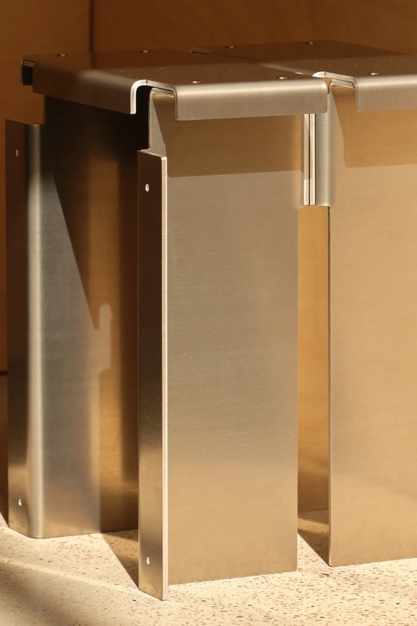  Close-up of the sturdy construction and detailed craftsmanship of the Segment Stool