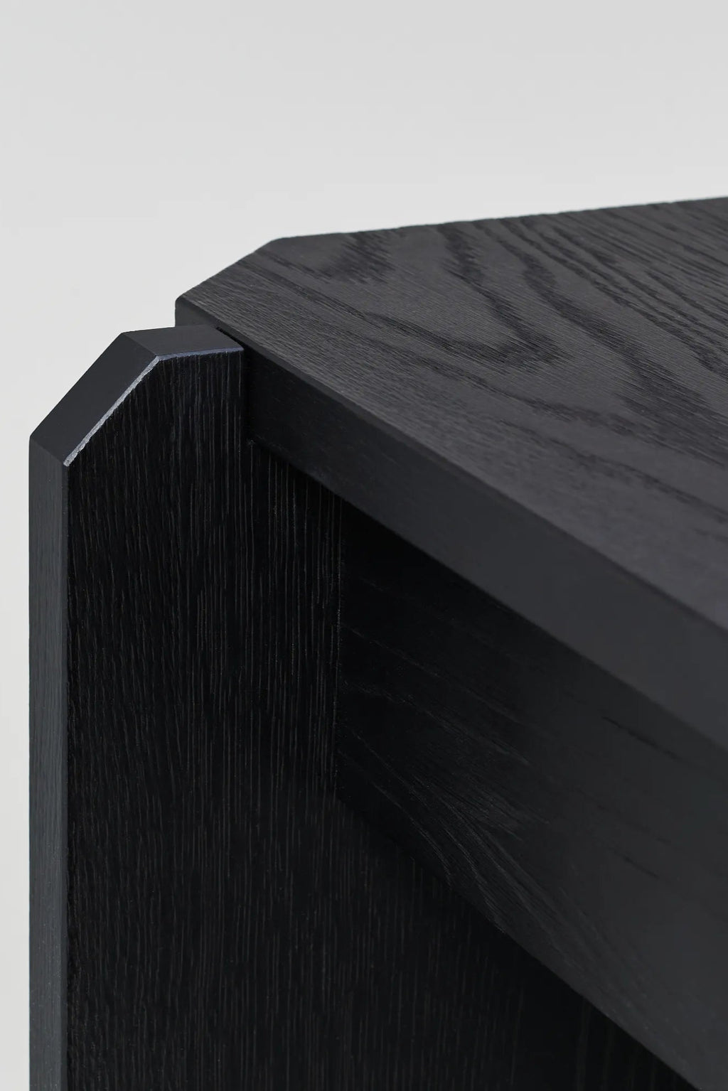 Modern round wooden coffee table with stamp-like design, in natural oak finish