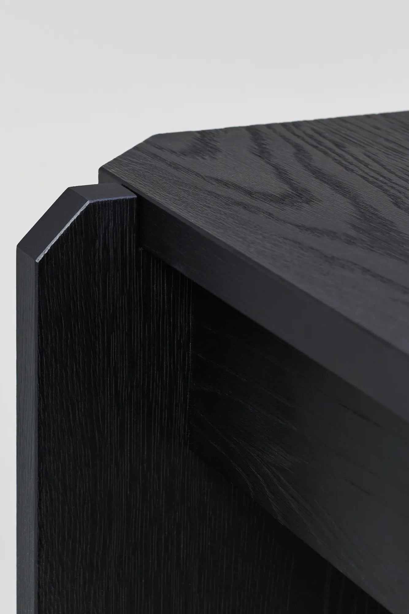 Modern round wooden coffee table with stamp-like design, in natural oak finish