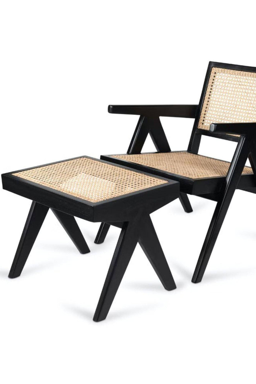 Detjer Chandigarh Easy Lounge Footstool, a mid-century modern ottoman featuring a matte black solid wood frame with distinctive angular V-shaped legs and a natural hand-woven cane rattan top.