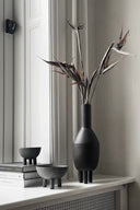###
A sleek and modern slim duck vase in white ceramic finish