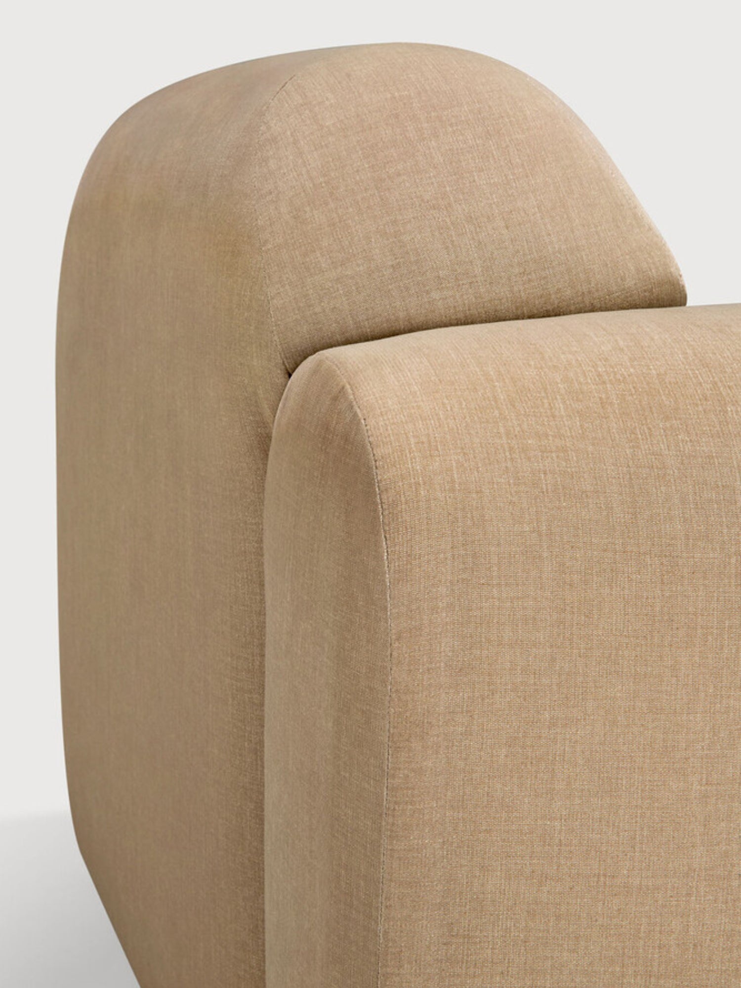 Ethnicraft Bulky Modular Sofa, a detailed view of the back and side of the end seater module with a right arm, highlighting the seamless construction and luxurious light brown textured fabric.