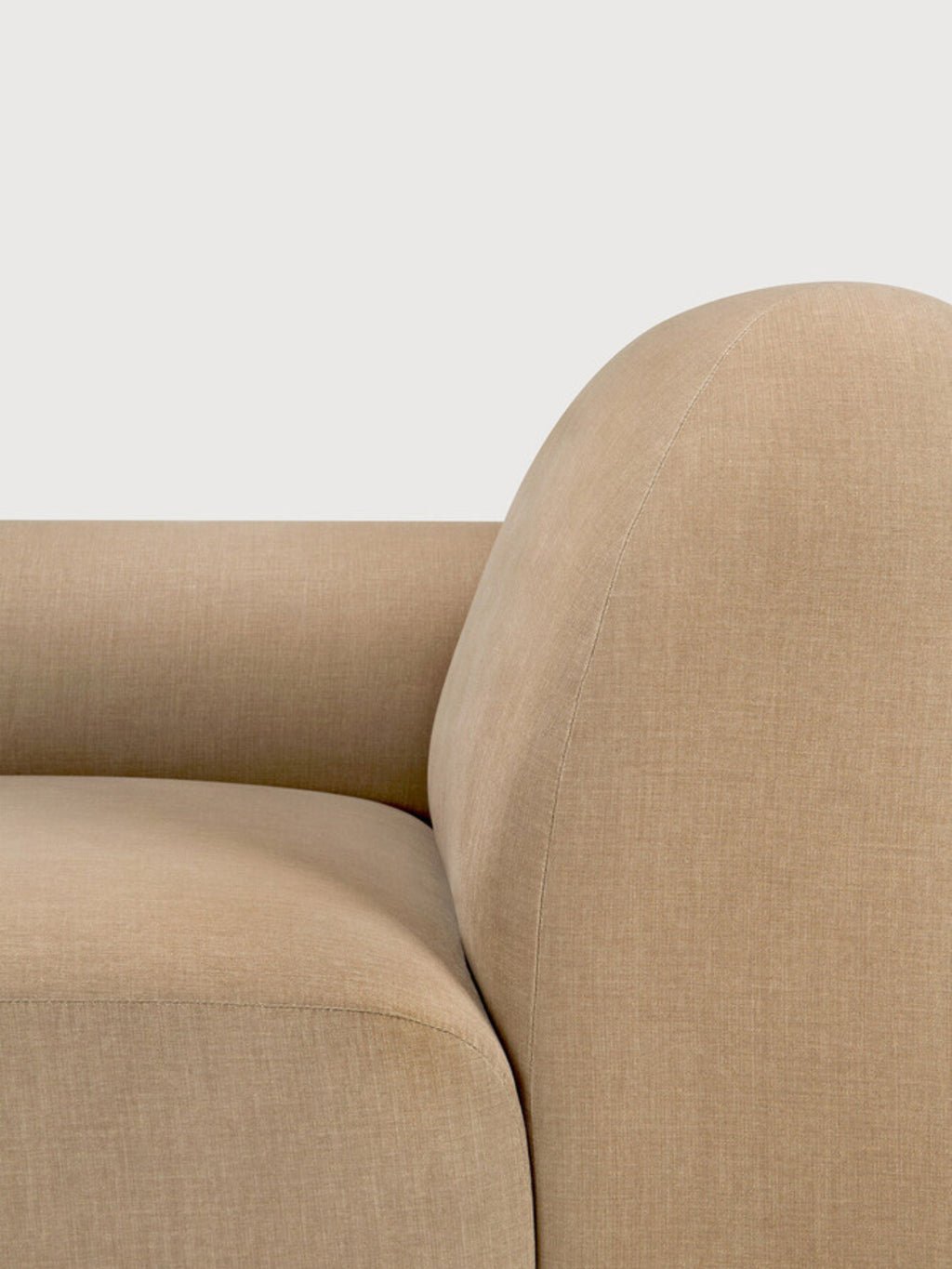 Ethnicraft Bulky Modular Sofa, a close-up detail of the end seater module with a right armrest, showcasing the smooth, rounded curve and premium light brown textured fabric against a soft white background.