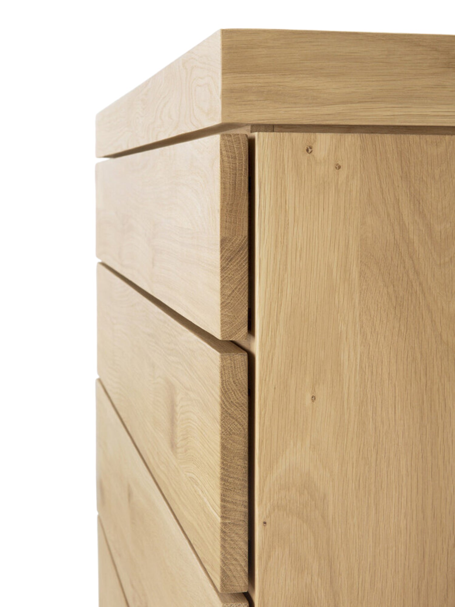 Ethnicraft Burger Dresser in Oak, a detailed side view showcasing the stacked, clean lines of the light natural oak wood drawers, highlighting the minimalist and robust construction.