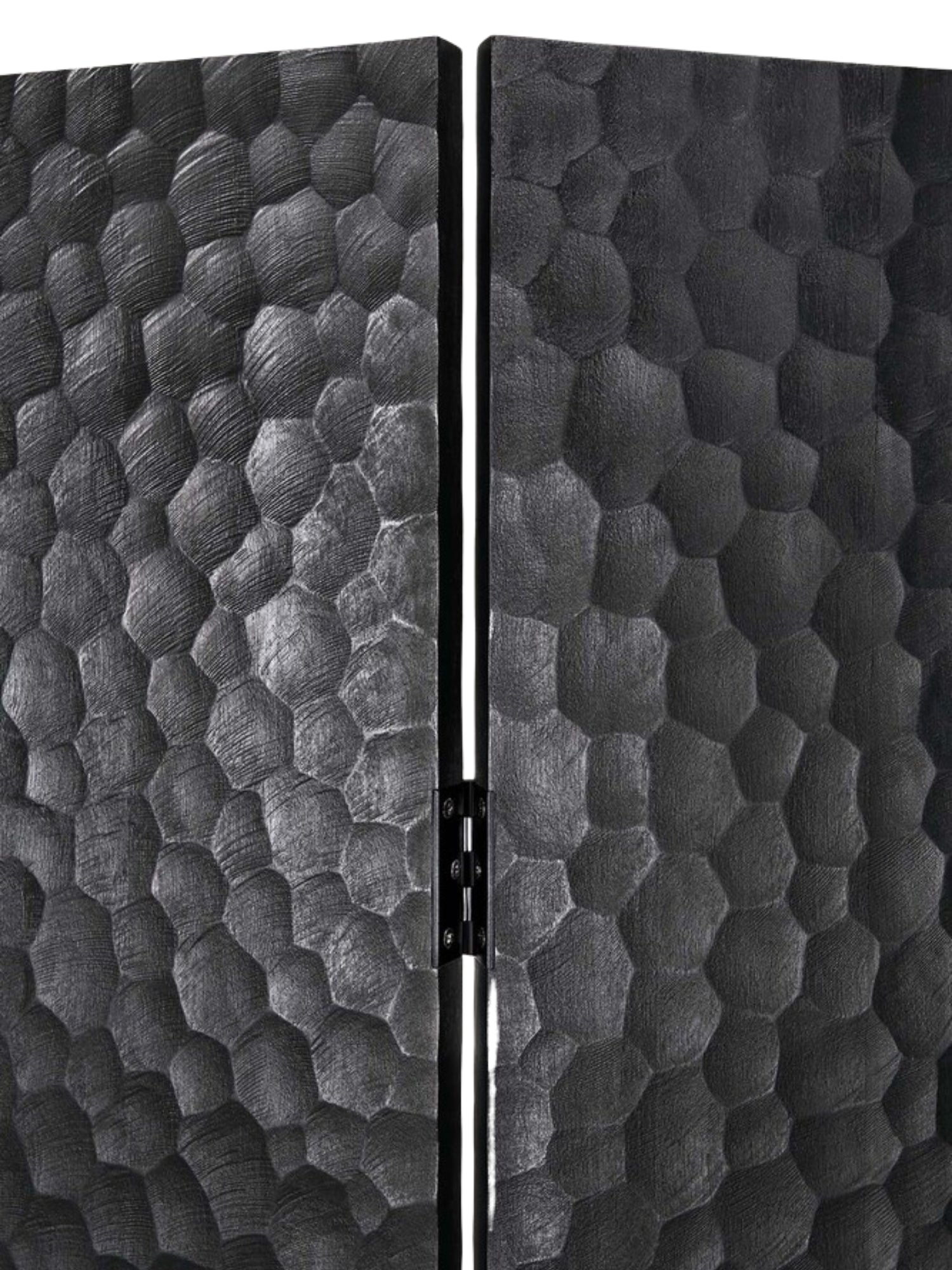 Ethnicraft Chopped Room Divider, a detailed close-up of two panels of the mahogany black screen, highlighting the rich, hand-carved, organic honeycomb-like texture and the sturdy hinge mechanism.