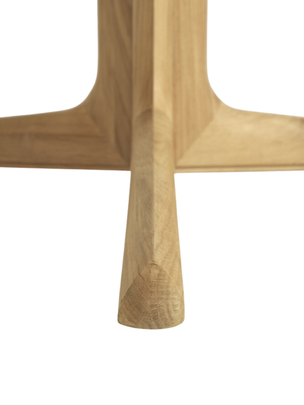 Ethnicraft Corto Dining Table, a round oak table, with a detailed shot of the sturdy, cross-shaped base legs in light brown wood, emphasizing the modern, minimalist design on a white background.