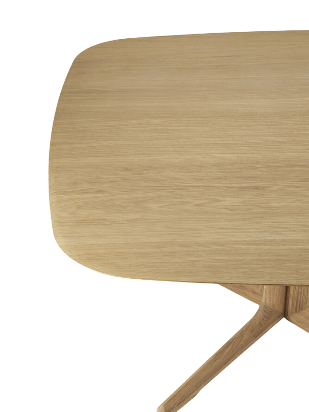 Ethnicraft Corto Dining Table, a close-up of the square oak tabletop's smooth, natural finish and gently curved edges, emphasizing the quality and modern design.