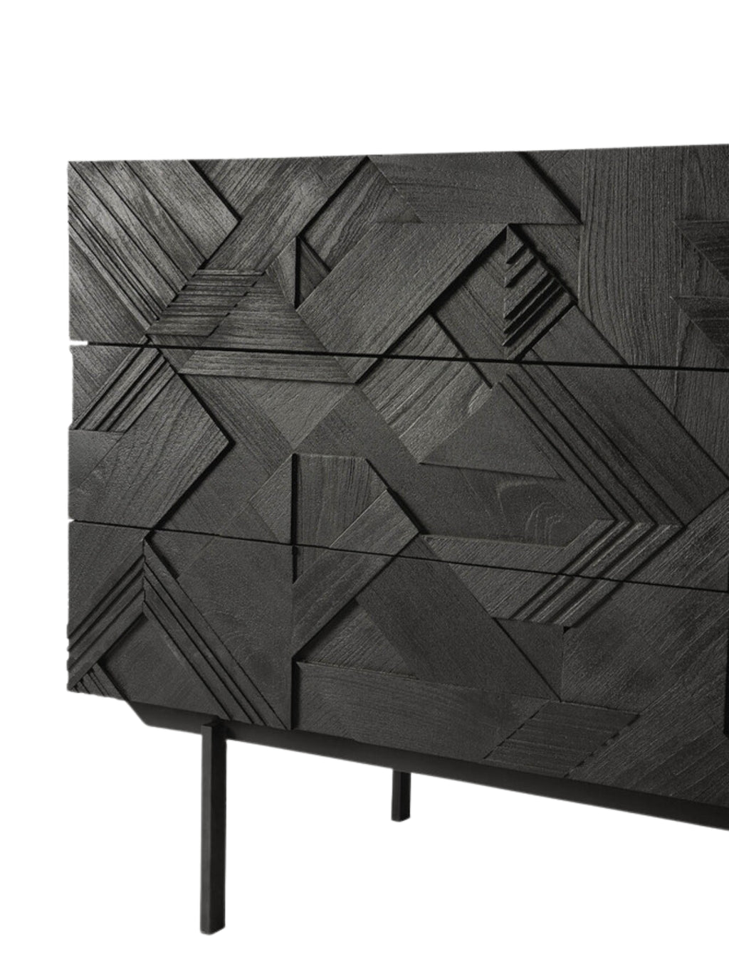 Ethnicraft Graphic Dresser, a close-up detail of the rich black teak wood surface, highlighting the deep, intricate geometric carved pattern on the drawer fronts. The textured design adds a luxurious and modern feel to this premium piece.