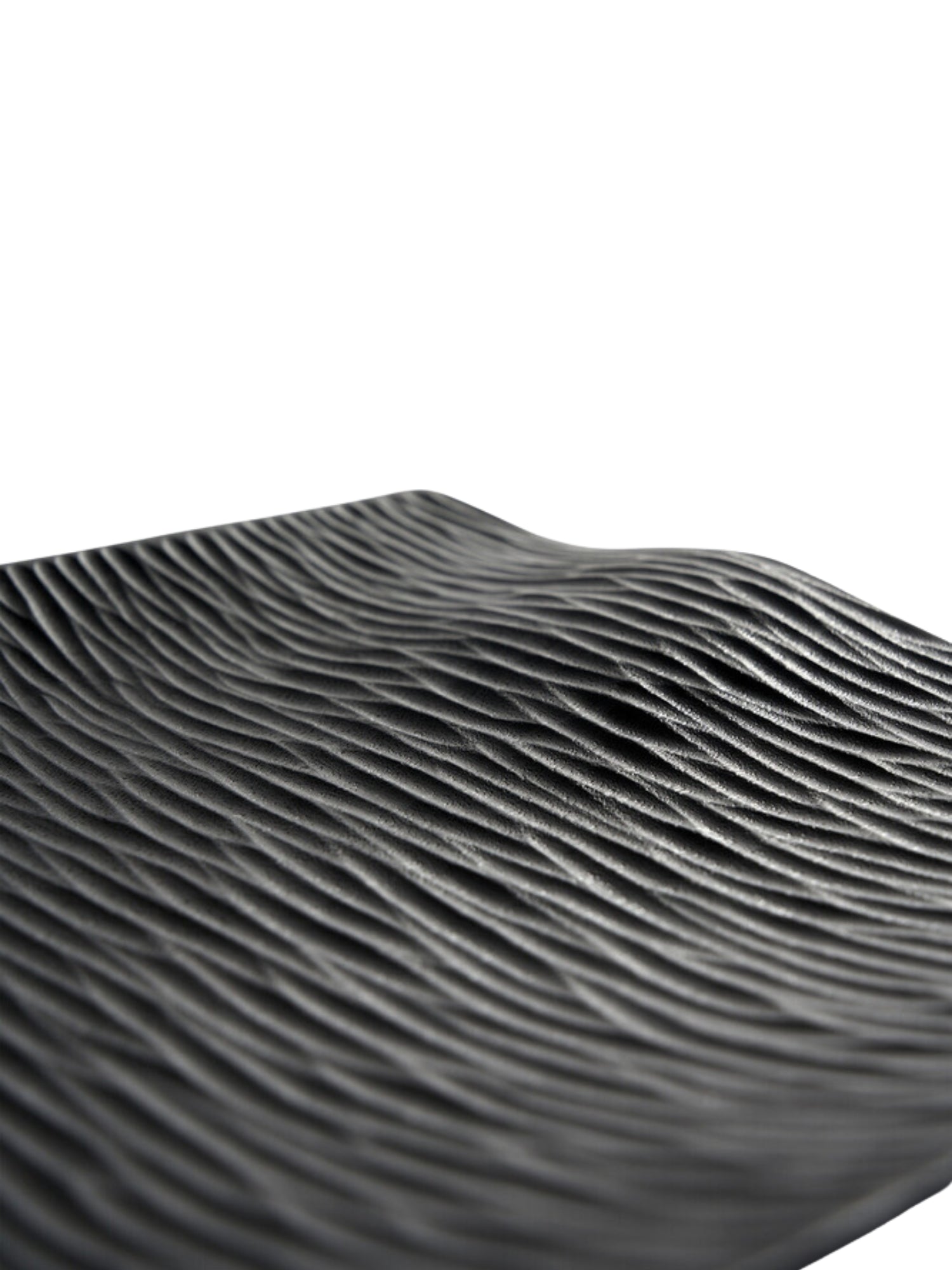 Ethnicraft Japan Board, a detailed close-up of the black serving board's surface, showcasing its intricate, wave-like textured pattern. The dark, matte finish and organic ripples create a sophisticated and tactile design, presented on a white background.