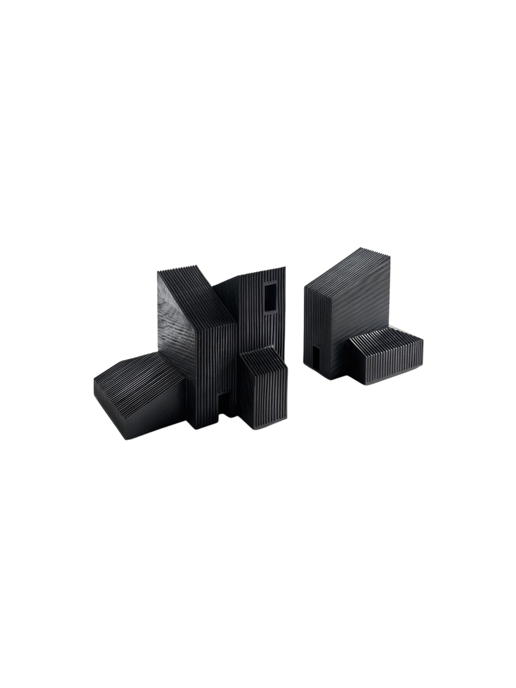 Ethnicraft Modern Farmhouse Object, a set of two abstract, black wooden sculptures with ribbed textures. These unique decorative pieces resemble architectural forms, displayed against a clean white background.