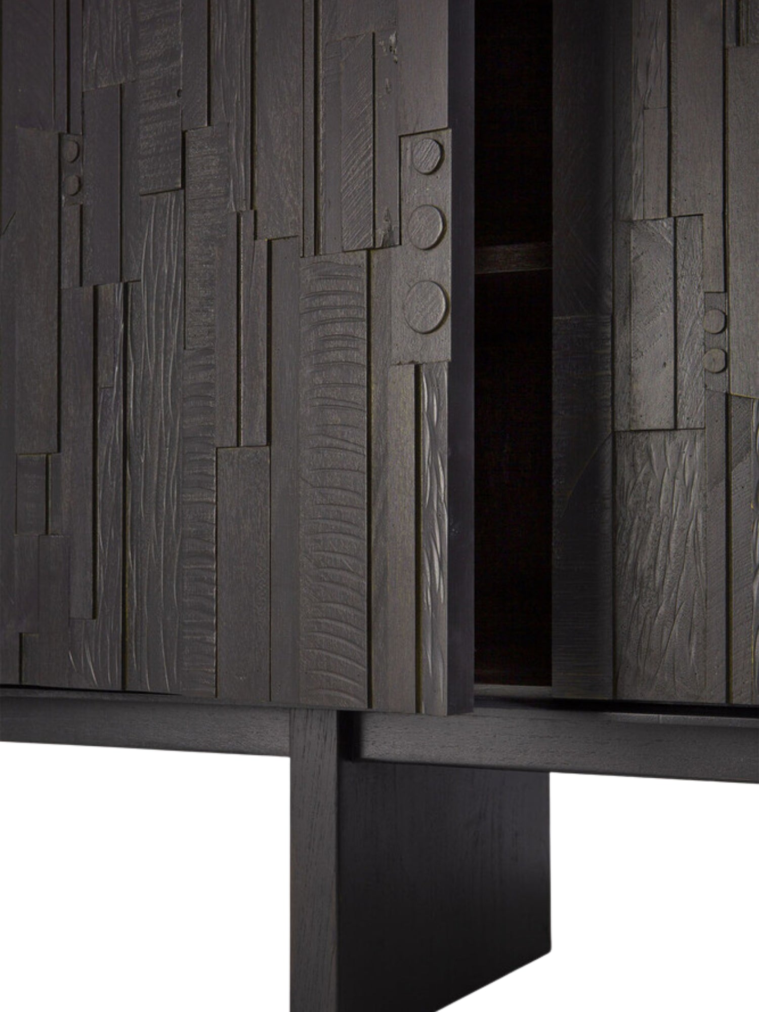 Ethnicraft Mosaic Sideboard, a close-up detail showing the dark off-black teak wood door slightly ajar, highlighting the unique mosaic texture and the interior shelving of this elegant, modern piece.