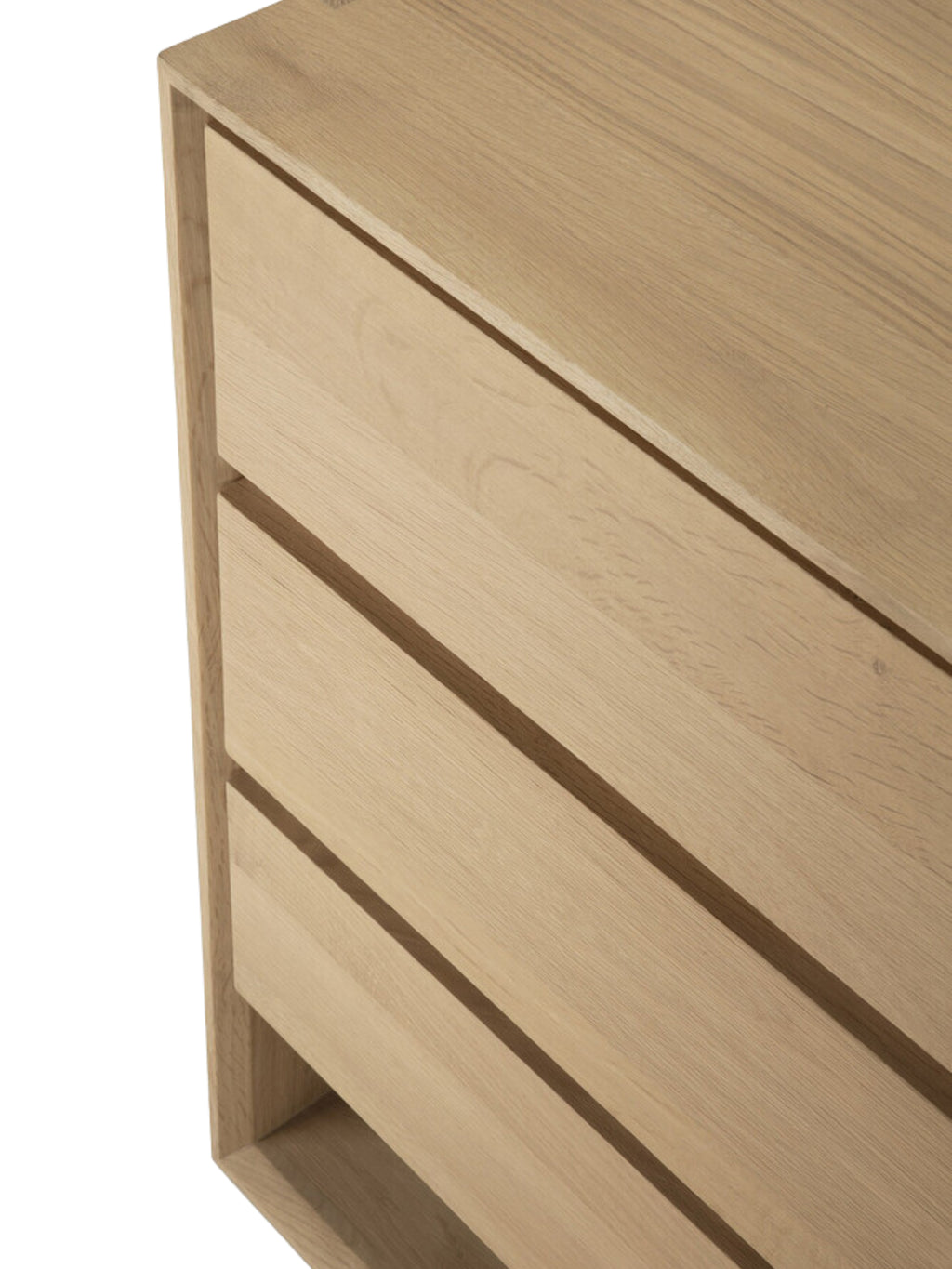 Ethnicraft Nordic Dresser, a close-up angle showcasing the top three drawers of the light oak dresser, emphasizing the clean lines and elegant wood grain on a white background.