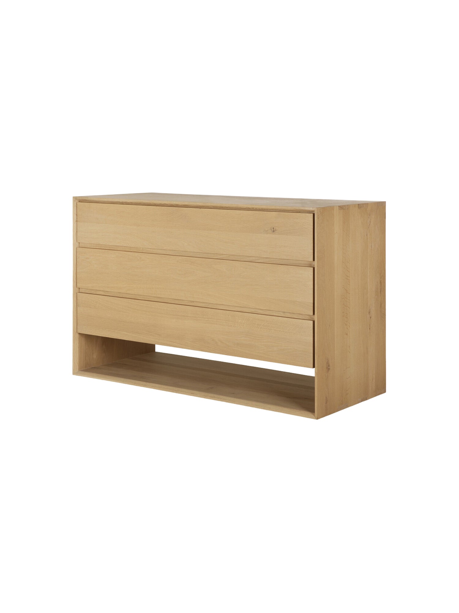 Ethnicraft Nordic Dresser, a modern light oak wood dresser with three clean-lined drawers and an open bottom shelf. The natural wood grain and minimalist design offer a timeless aesthetic, presented on a bright white background.