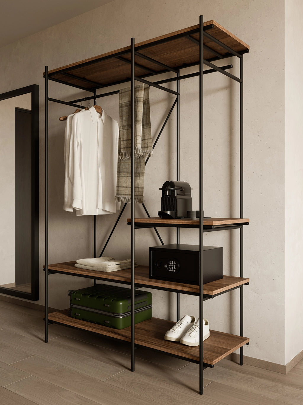 Ethnicraft Oscar Hanging Rack, a stylish industrial-chic wardrobe unit with a dark metal frame and warm teak wood shelves, displaying clothes, a safe, and shoes in a modern room.