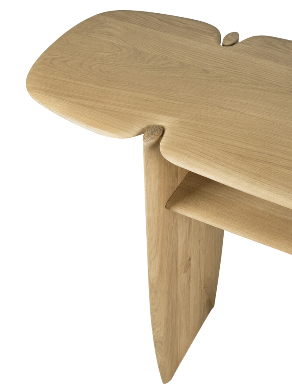 Ethnicraft PI Console in natural oak, a close-up detail shot emphasizing the smooth, light wood grain and the unique, curved joint where the leg meets the tabletop, showcasing premium craftsmanship.