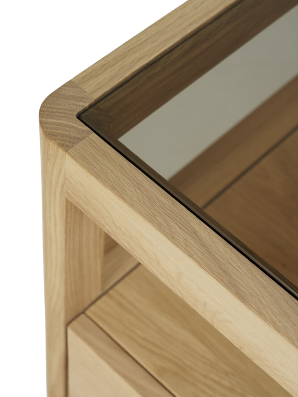Ethnicraft Spindle Dresser, a premium oak dresser with a clear glass top, showcasing fine craftsmanship and natural wood grain, displayed on a clean white background.