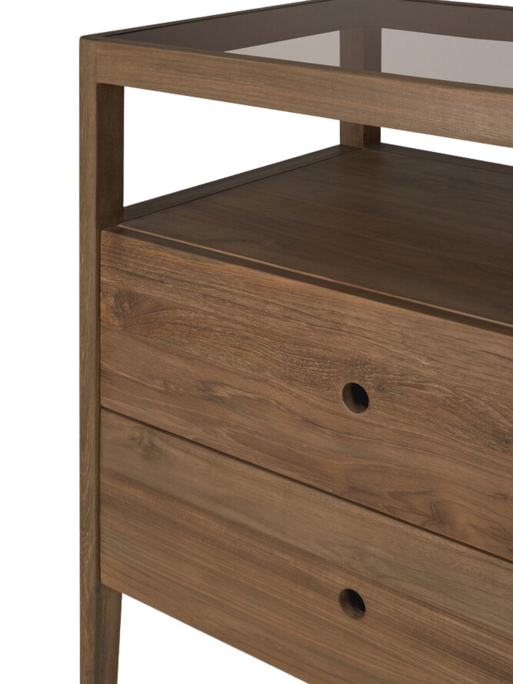 Ethnicraft Spindle Dresser, a detailed view of the rich, dark reclaimed teak wood, featuring two drawers with circular cut-out handles and a clear glass top, on a white background.