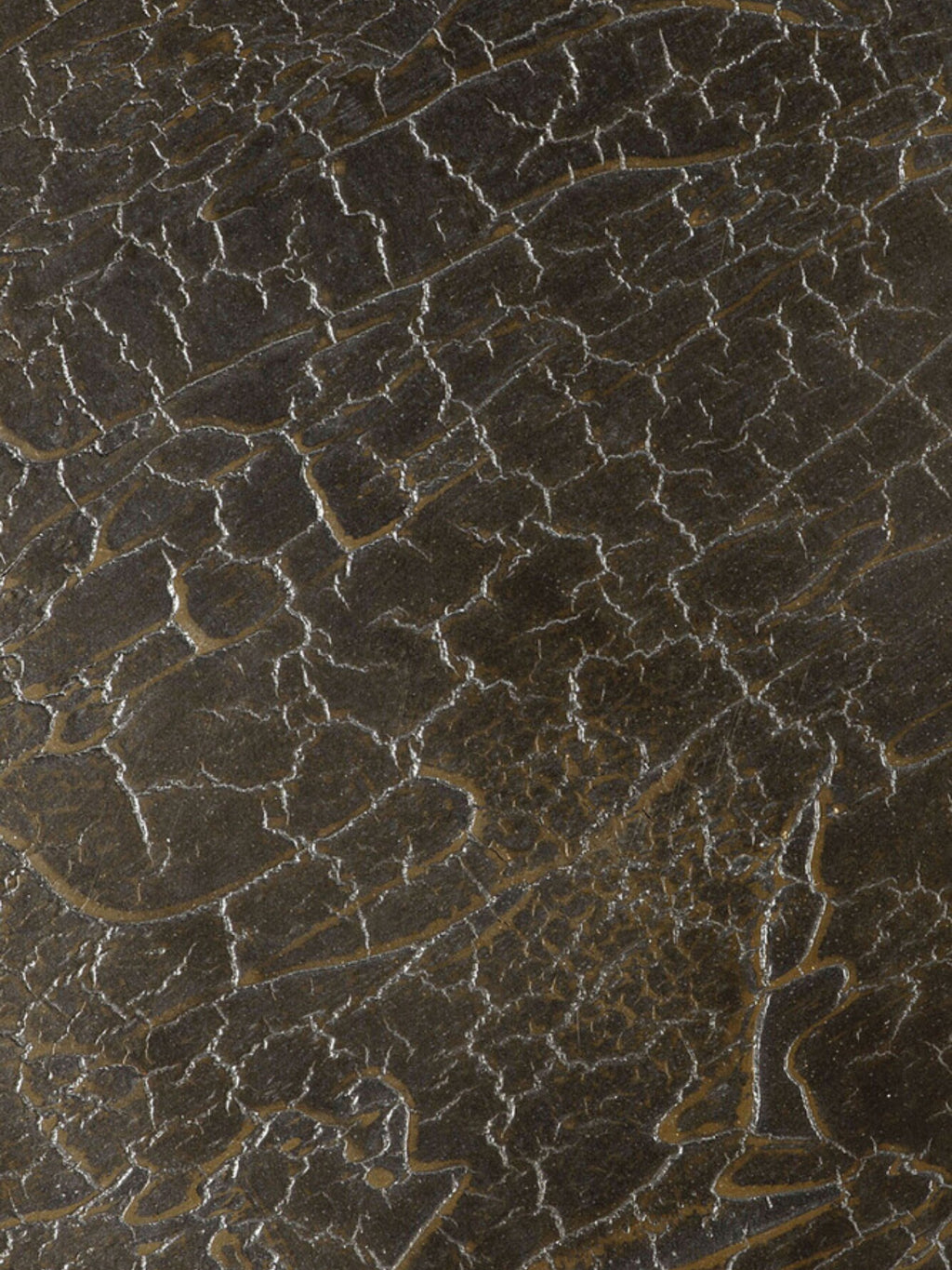 Close-up detail of the Ethnicraft Stability Console's rich, dark brown, textured surface. The intricate, cracked pattern and subtle variations in color highlight the premium craftsmanship and unique material finish of the console.