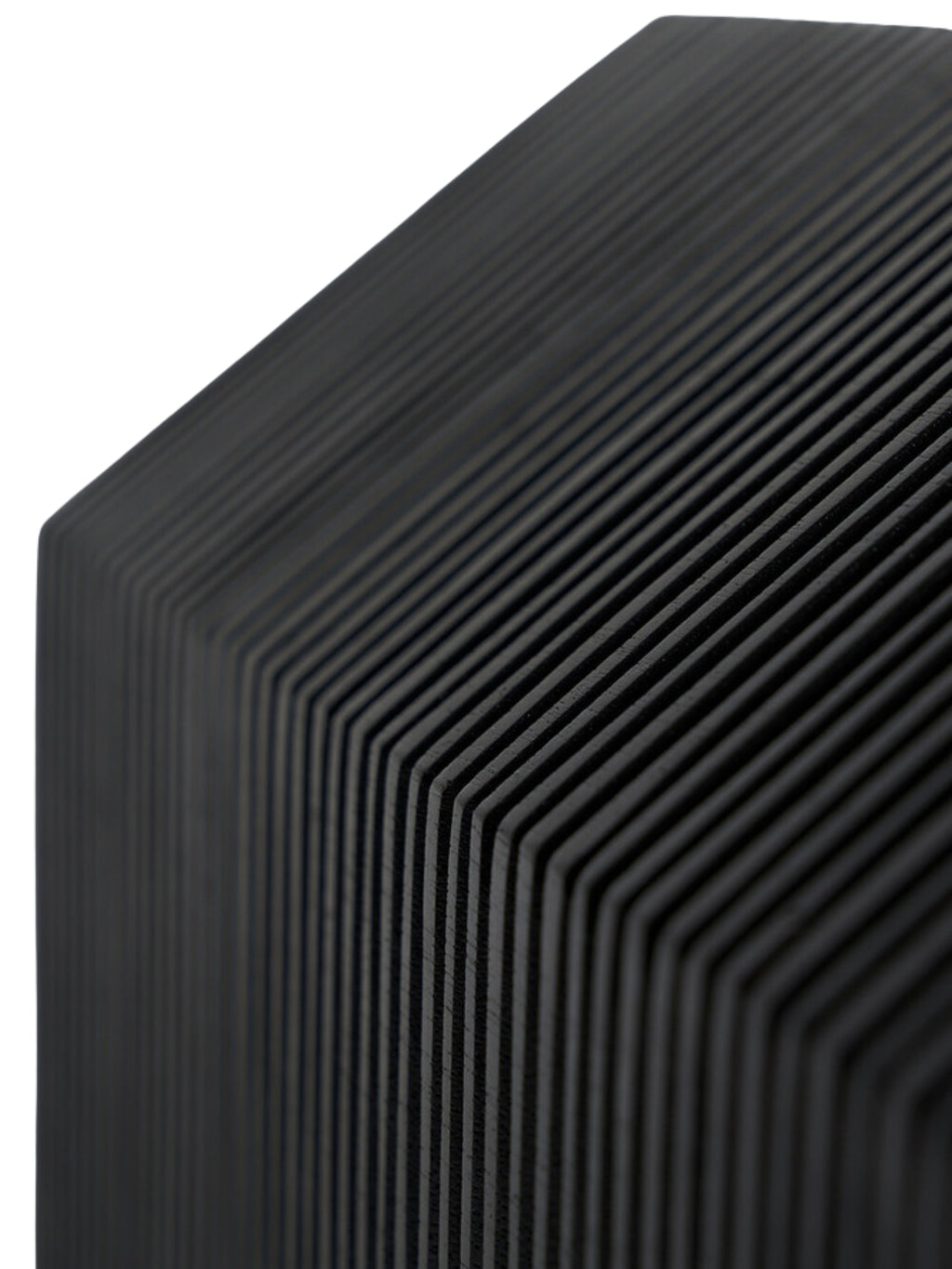Ethnicraft Stilt House Object. Extreme close-up of the dark black wooden house sculpture, emphasizing the fine, parallel ribbed texture that creates a unique, modern pattern across its surface, against a white background.