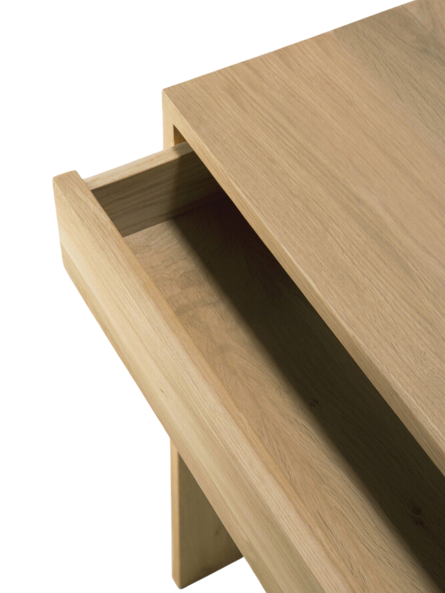 Ethnicraft Wave Desk, a premium solid oak desk, featuring a detailed view of its open, integrated drawer, revealing the smooth, light brown wooden interior and craftsmanship, on a white background.