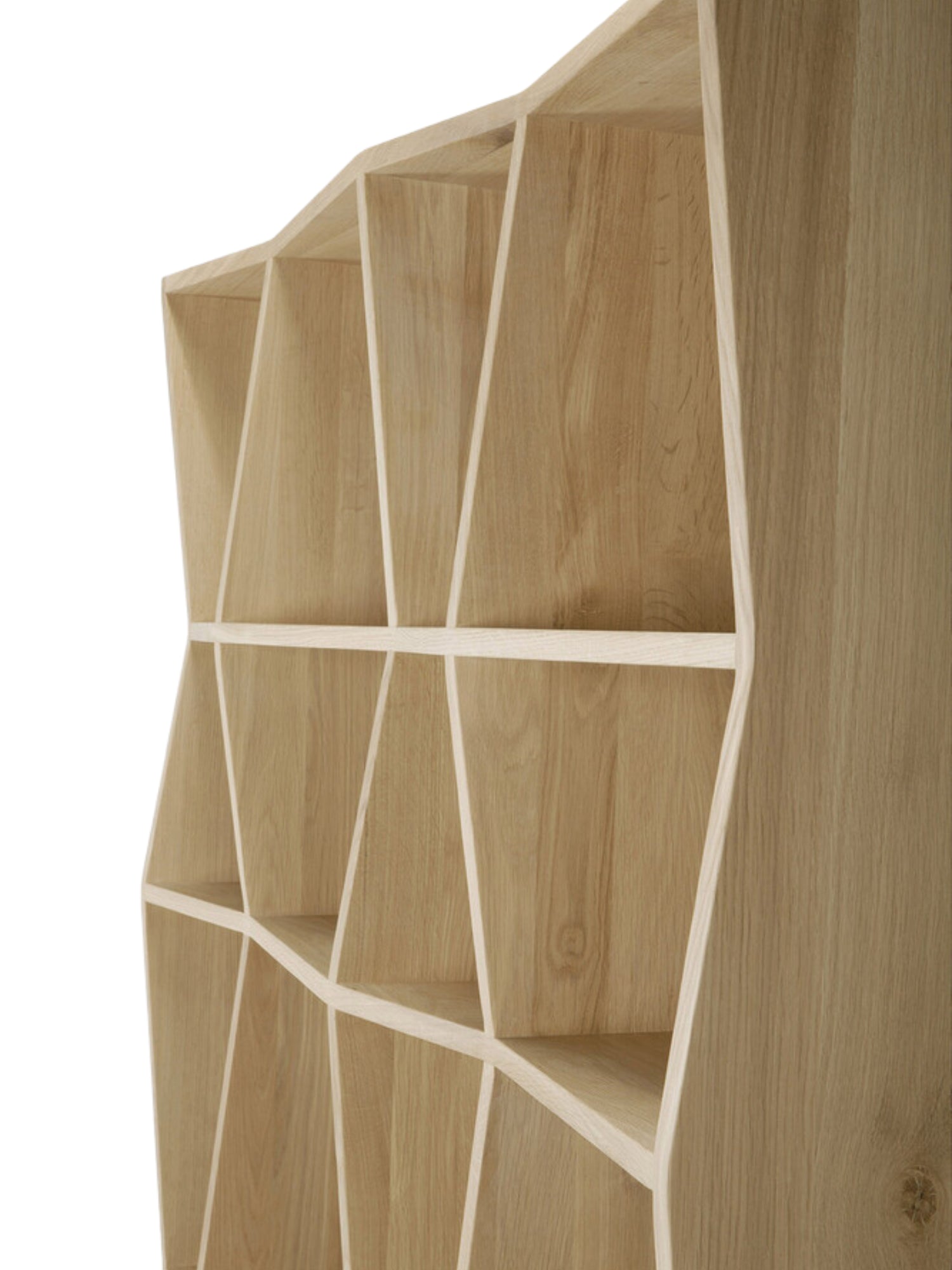 Ethnicraft Z Rack, an angled view of the tall, natural light oak wood shelving unit, highlighting its distinctive, sculptural Z-shaped internal structure and smooth finish.