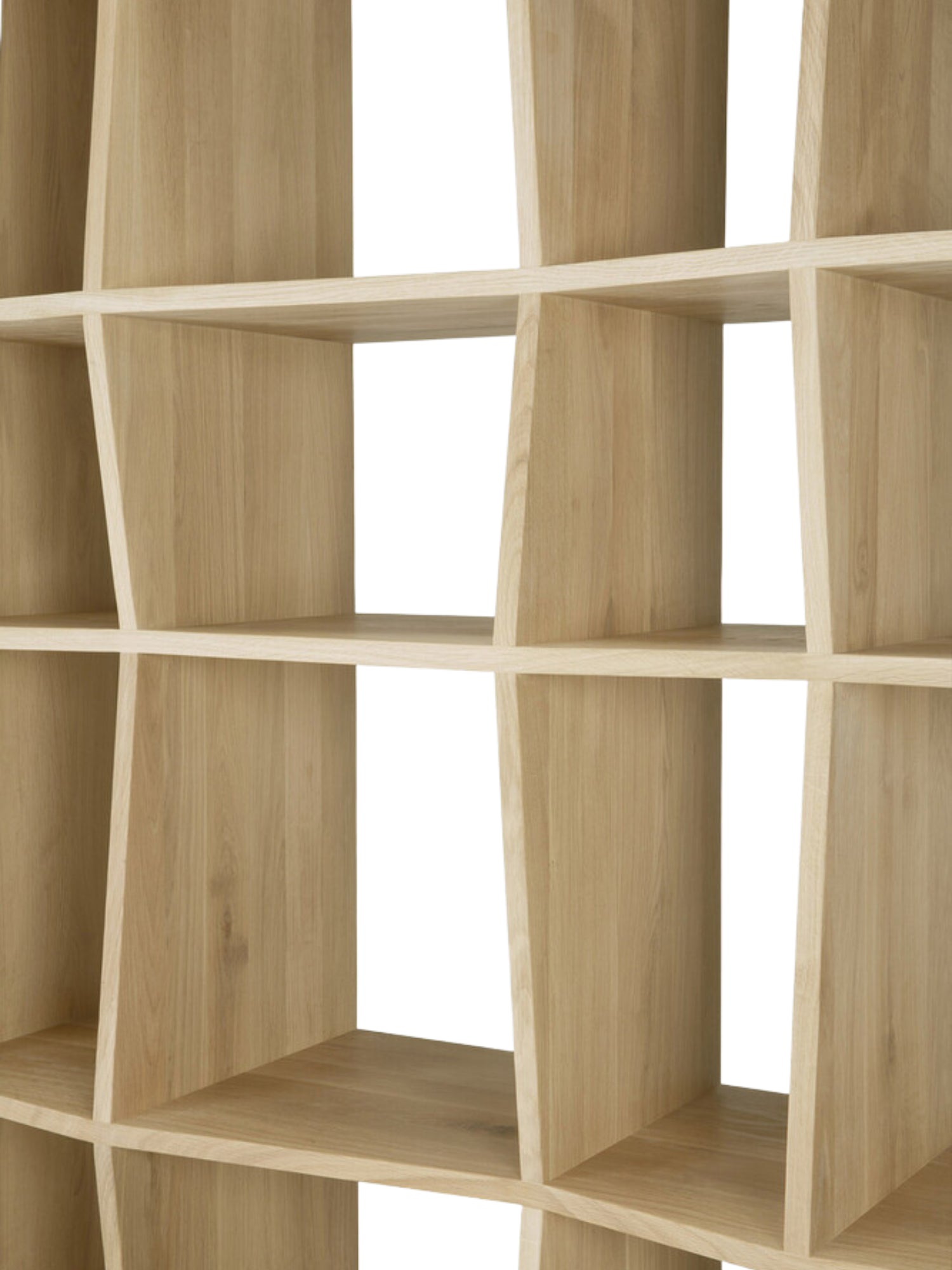 Ethnicraft Z Rack, a detailed shot of the natural light oak wood shelving unit's interior, emphasizing the precise, geometric Z-shaped dividers creating various storage cubbies.