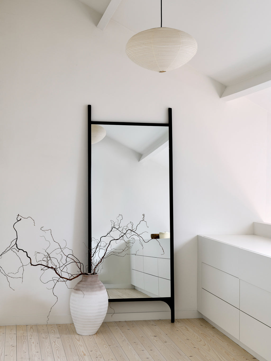 Ethnicraft PI Floor Mirror, a sleek modern minimalist floor mirror featuring a matte black metal frame with clean lines and a distinctive PI-shaped silhouette, offering a full-length reflection. Ideal as a contemporary standing mirror for bedrooms, entryways, or living rooms in Scandinavian or industrial chic interiors.