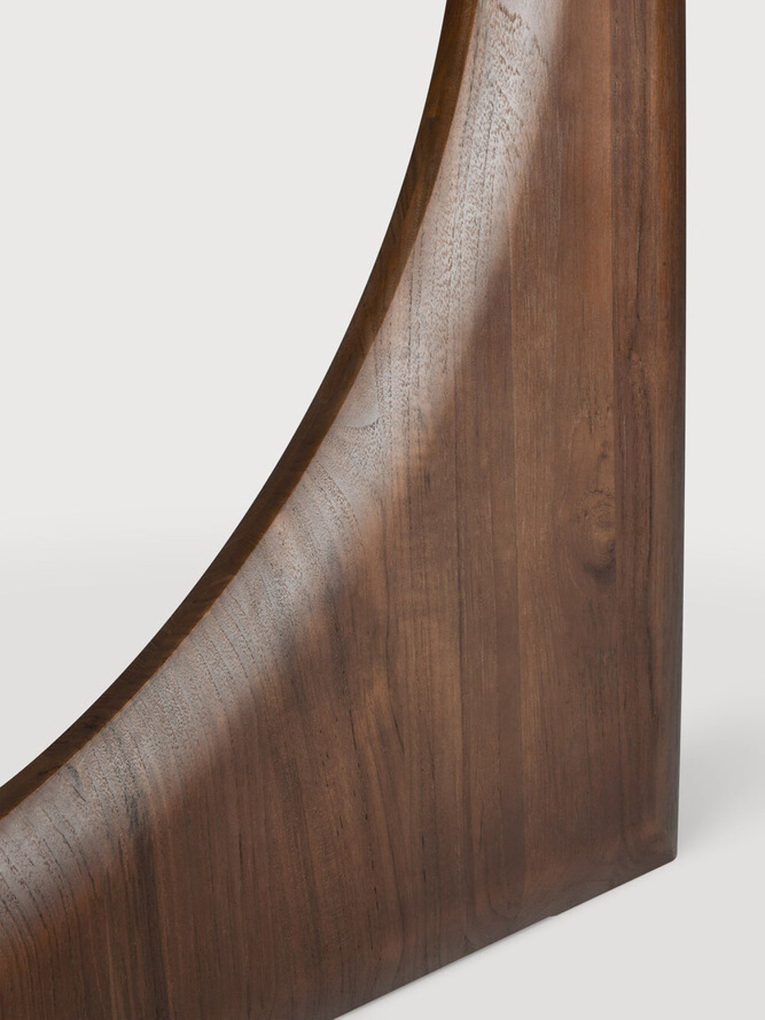 Ethnicraft Geometric Dining Table, a modern sculptural dining table crafted from rich solid dark wood with a smooth, polished finish and distinct curved geometric base. This contemporary solid wood dining table is perfect as a statement piece for dining rooms or open-plan living spaces.