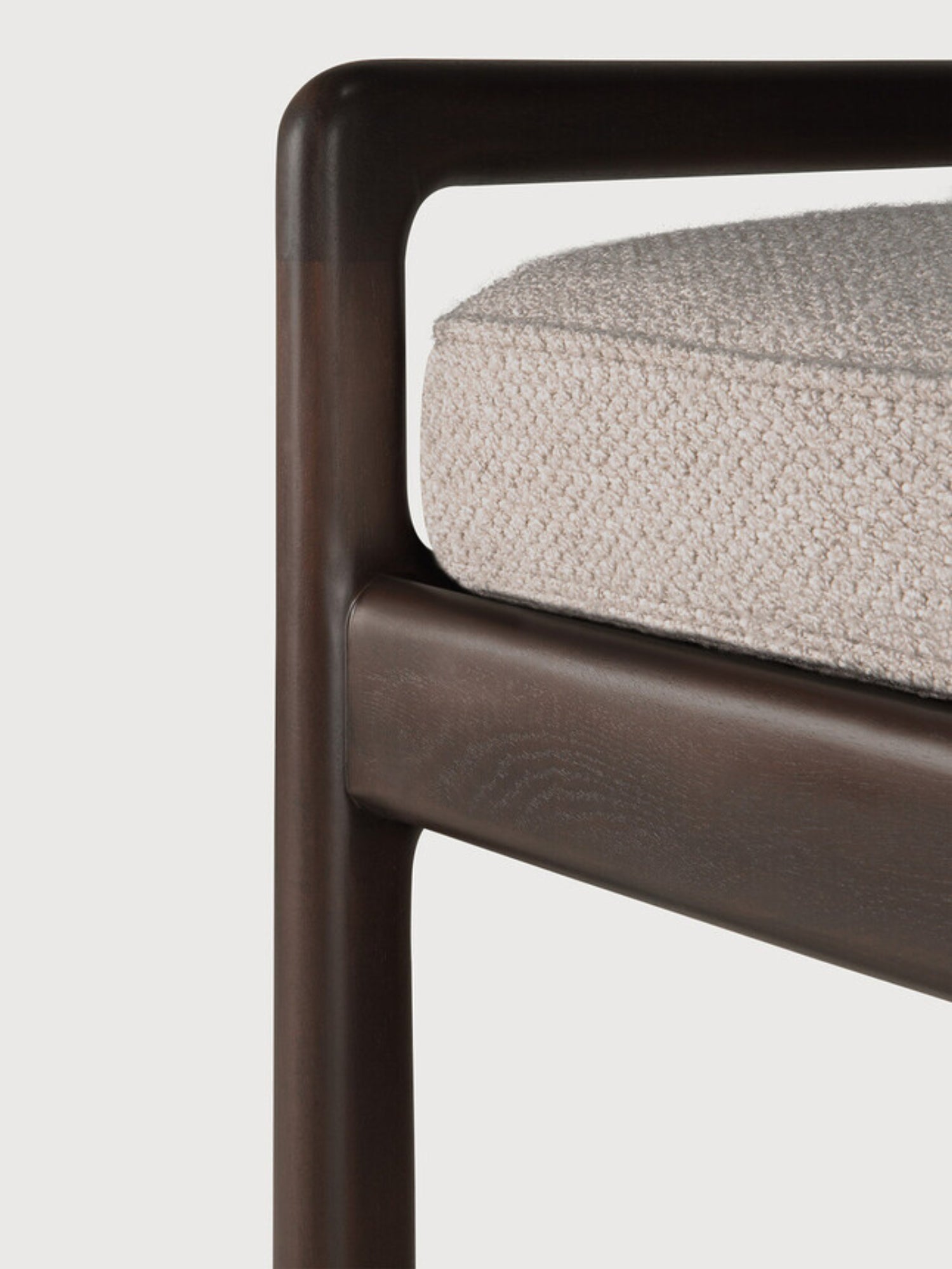 Ethnicraft Jack Bench, a detailed view of the elegant mahogany dark brown wooden frame and the soft ivory fabric cushion, emphasizing the seamless joinery and luxurious texture.