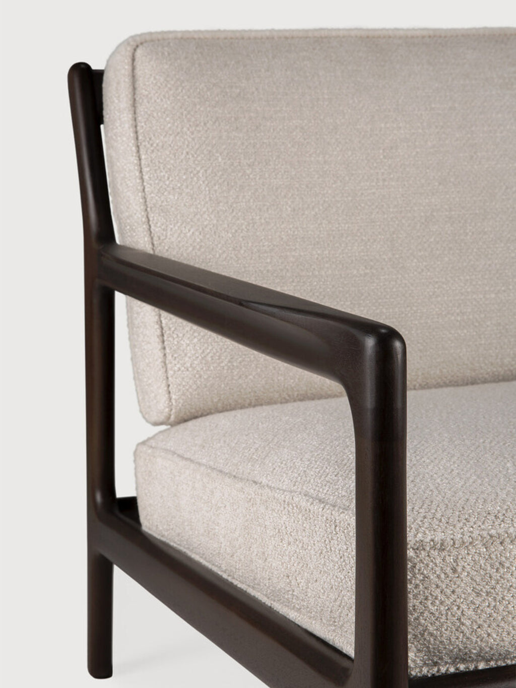 Ethnicraft Jack Lounge Chair, a modern minimalist armchair featuring a sturdy dark solid wood frame with plush, textured cream bouclé upholstery and elegantly curved armrests, showcasing clean, organic lines.