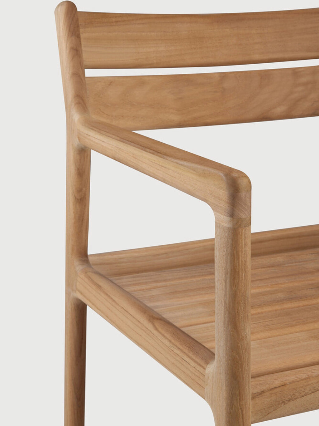 Ethnicraft Jack Outdoor Dining Chair With Armrest, a modern minimalist outdoor dining chair crafted from warm natural solid teak wood with a smooth finish, featuring clean lines, a slatted backrest and seat, and gently curved integrated armrests. This contemporary teak armchair is perfect for stylish outdoor dining, patio furniture sets, or organic modern garden spaces.