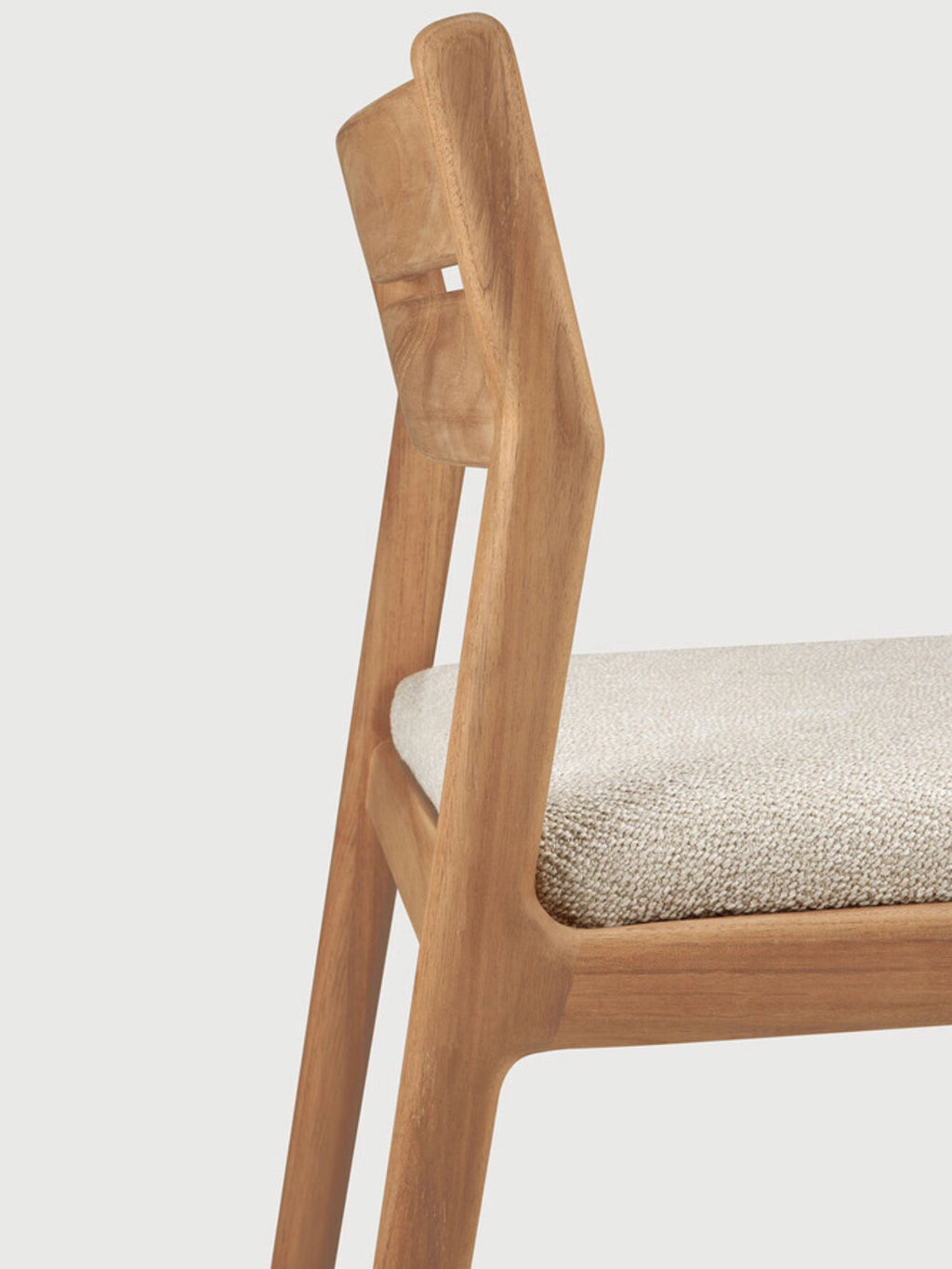 Ethnicraft Jack Outdoor Dining Chair Without Armrest, a modern minimalist dining chair crafted from solid teak wood with warm natural wood tones and a gently curved backrest. It features an integrated light beige textured fabric upholstered seat, embodying a contemporary outdoor design. Perfect for stylish outdoor dining areas, patios, and garden settings.