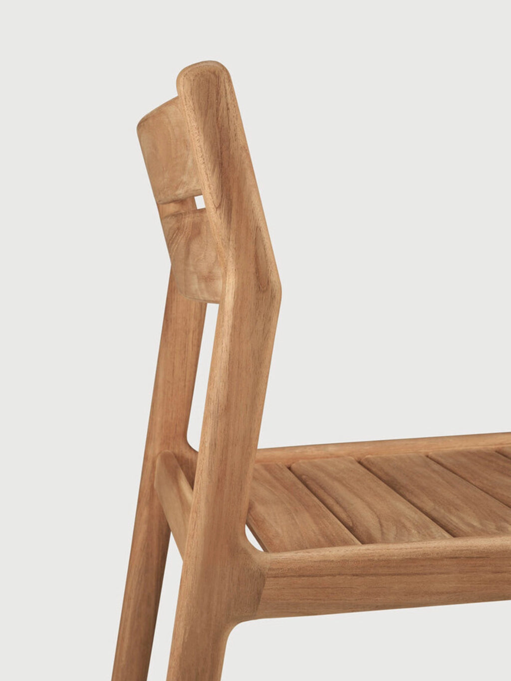 Ethnicraft Jack Outdoor Dining Chair Without Armrest, an organic modern dining chair meticulously crafted from natural solid teak wood, showcasing a warm golden brown hue and inviting smooth wood grain.