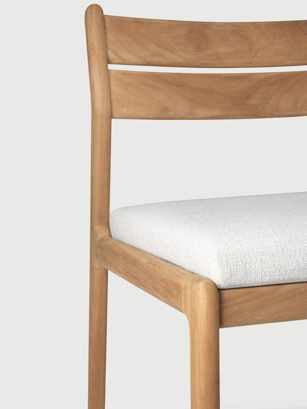 Ethnicraft Jack Outdoor Dining Chair Without Armrest, a modern minimalist dining chair crafted from natural solid teak wood with a smooth, light brown finish and clean, curved lines. It features a supportive slatted backrest and a comfortable white textured upholstered seat cushion, designed for enduring outdoor use. Perfect for contemporary patio dining, garden spaces, or Scandinavian-inspired outdoor living areas.