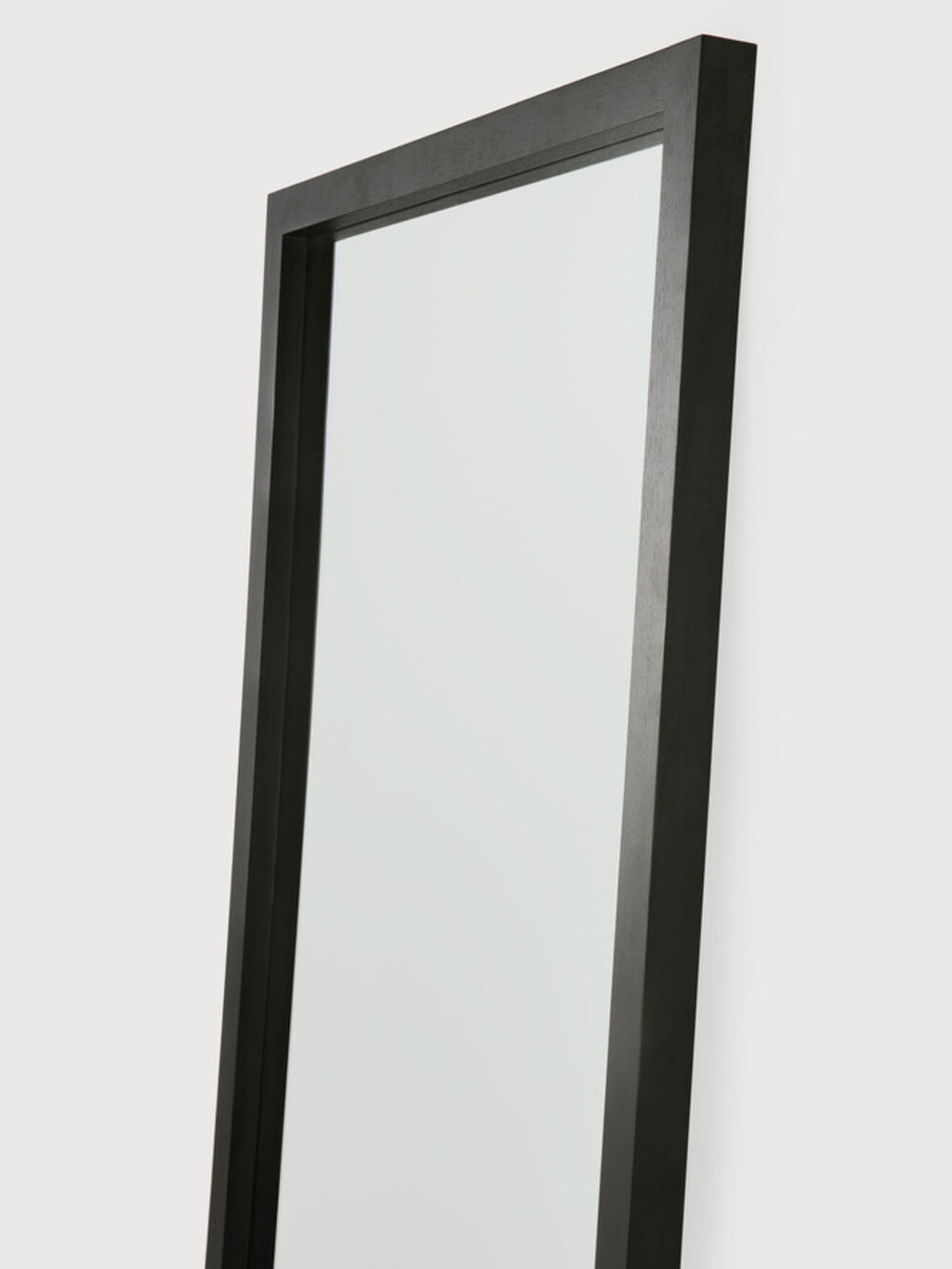 Ethnicraft Light Frame Floor Mirror, a modern minimalist full-length mirror featuring a slender, deep-set frame crafted from dark stained solid wood, likely black oak, with a subtle visible grain and clean lines. This contemporary floor mirror offers a sophisticated, understated aesthetic. Perfect for adding depth and style to Scandinavian bedrooms, Japandi living rooms, or chic entryways.