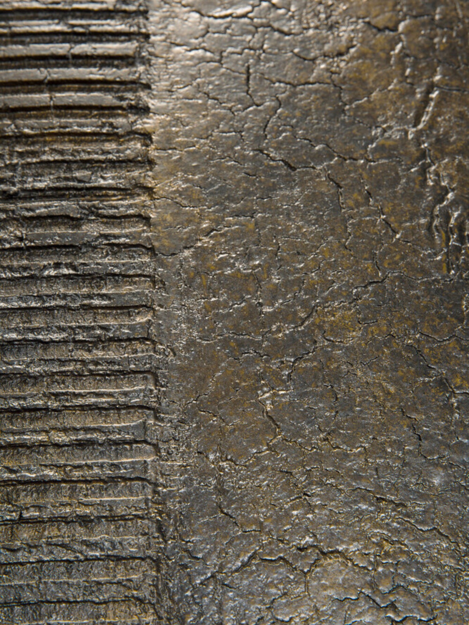 Ethnicraft Luna Coffee Table, a dark, brutalist-inspired coffee table featuring a heavily textured surface with contrasting finishes.