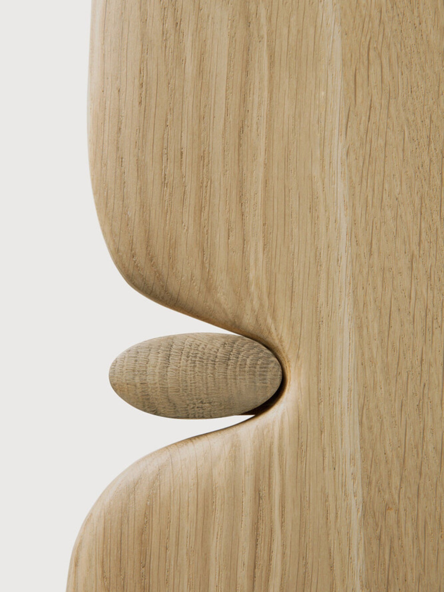 Ethnicraft PI Coffee Table in natural oak, rectangular shape. A detailed close-up highlights the innovative, organic joint design where the leg connects to the tabletop, showcasing the beautiful, light wood texture on a white background.