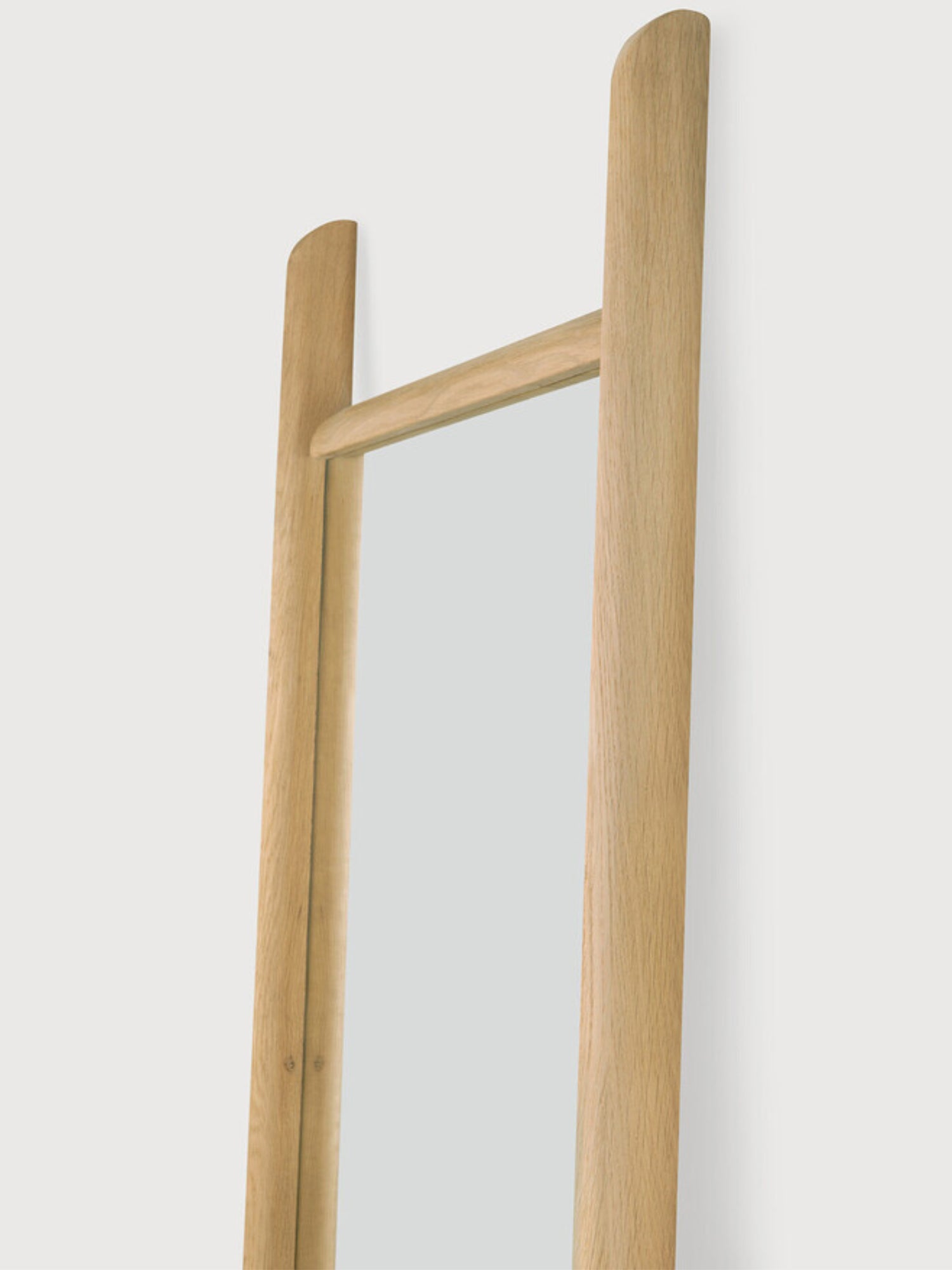 Ethnicraft PI Floor Mirror, a modern minimalist full-length floor mirror crafted from solid oak wood, featuring a unique ladder-style frame with gently rounded top edges and visible natural wood grain. This elegant Scandinavian design offers a warm, organic modern aesthetic with its light oak finish, perfect for contemporary interiors. Ideal as a stylish full-length mirror for bedrooms, entryways, or living rooms seeking a touch of natural elegance.