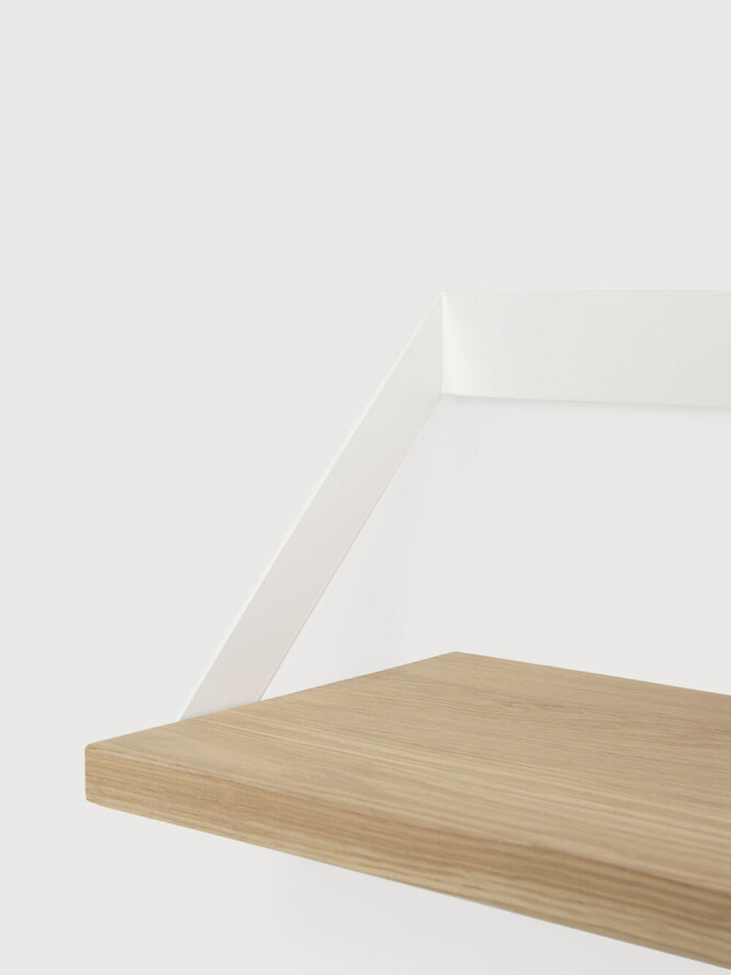 Ethnicraft Ribbon Shelf, a modern minimalist wall shelf featuring a light natural oak wood plank with a visible grain, supported by a clean white metal bracket that folds elegantly against the wall. This Scandinavian-inspired floating shelf is perfect for contemporary living rooms, bedrooms, or home offices for stylish display and storage.