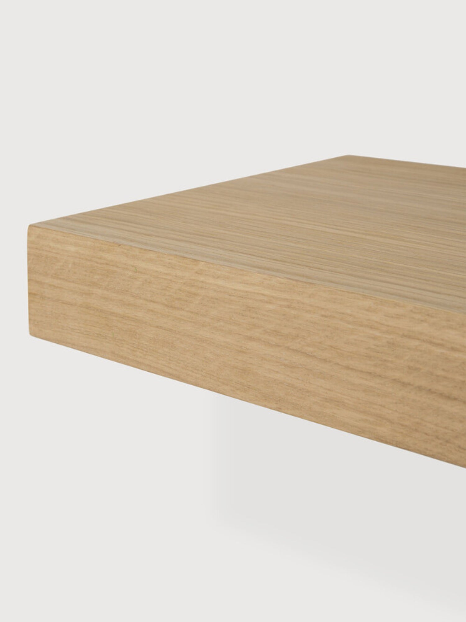 Ethnicraft Wall Shelf, a modern minimalist floating shelf crafted from solid oak with a light natural oak finish and distinctive wood grain texture, featuring a thick, rectangular profile.